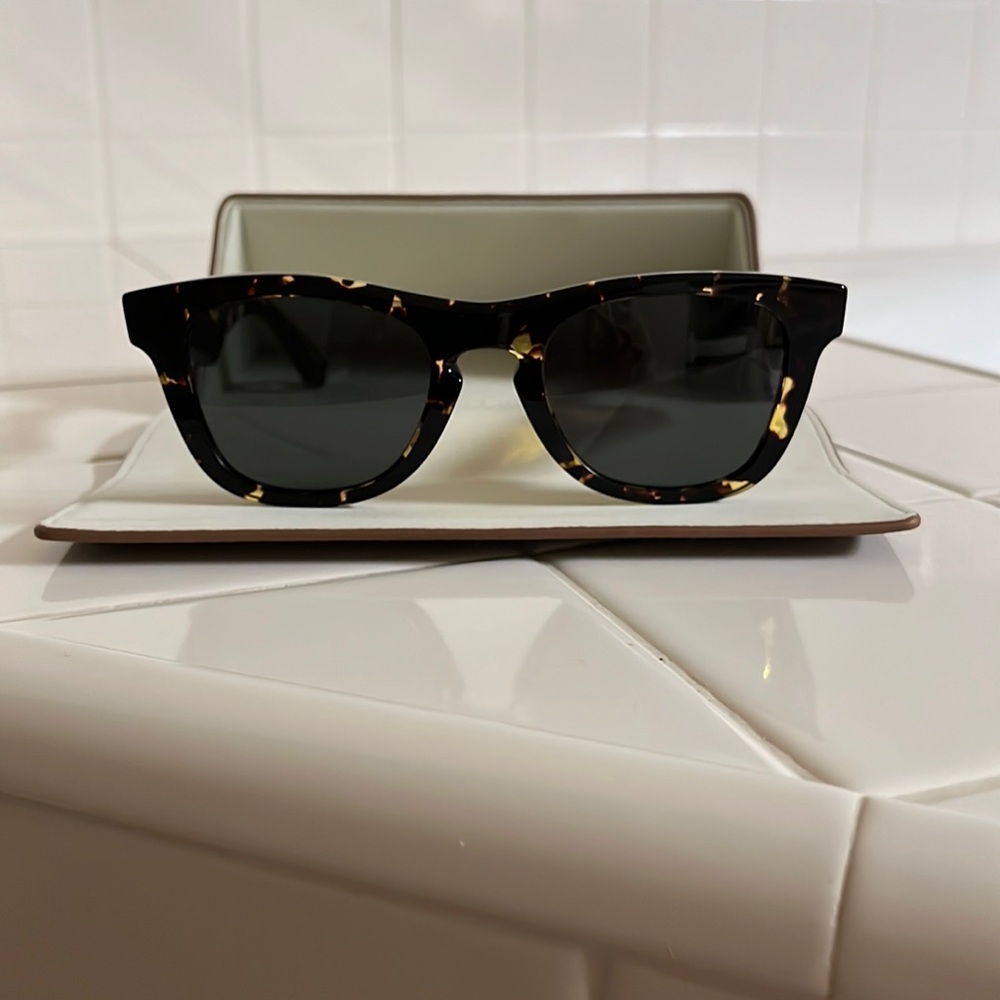 A woman sun glass made by Burberry.